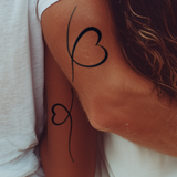 Verbundene Herzen Tattoo