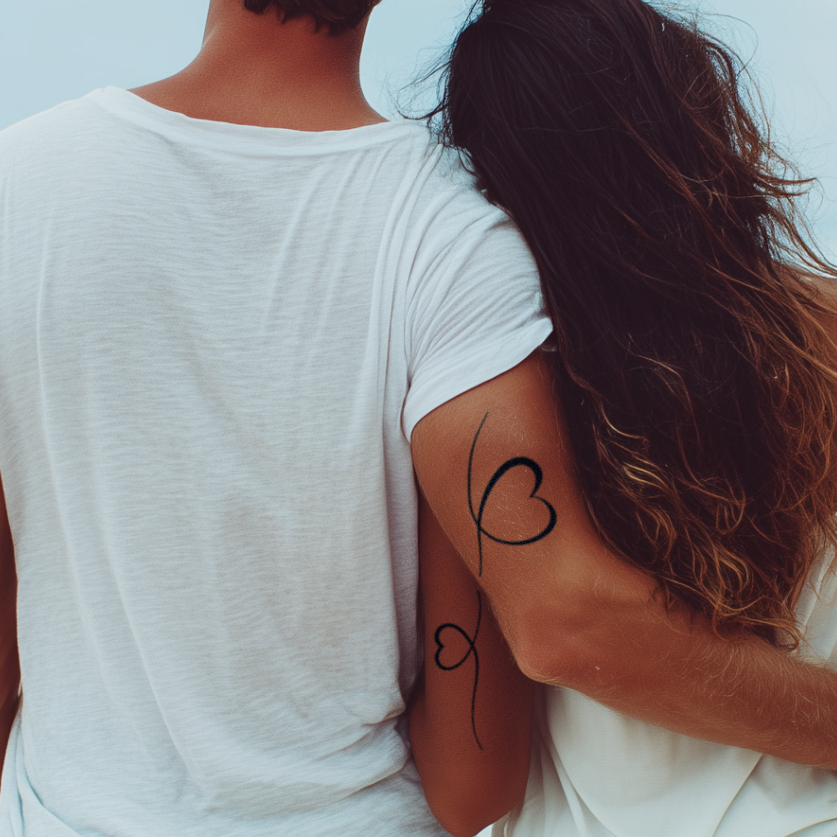 Verbundene Herzen Tattoo