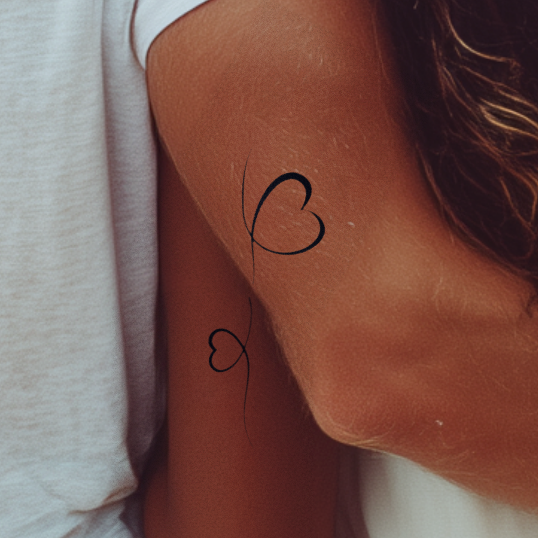 Verbundene Herzen Tattoo
